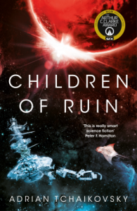 Book cover of Children of Ruin. Showing a space station under a red planet from which a bright light is shining